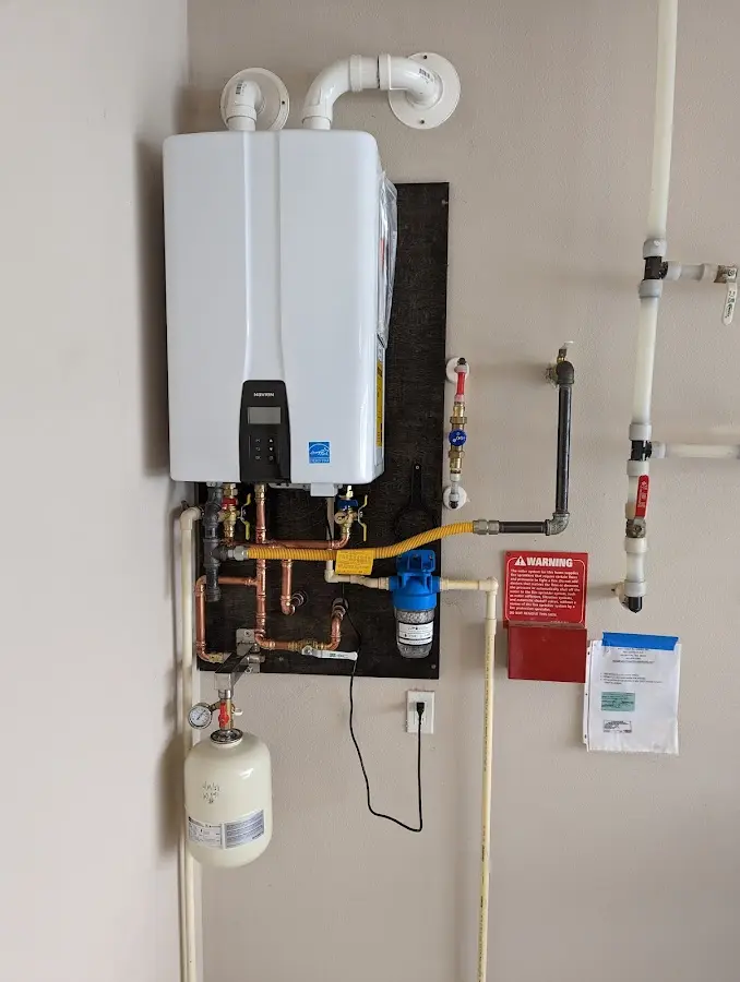 Professional plumber installing copper piping in a Key West home